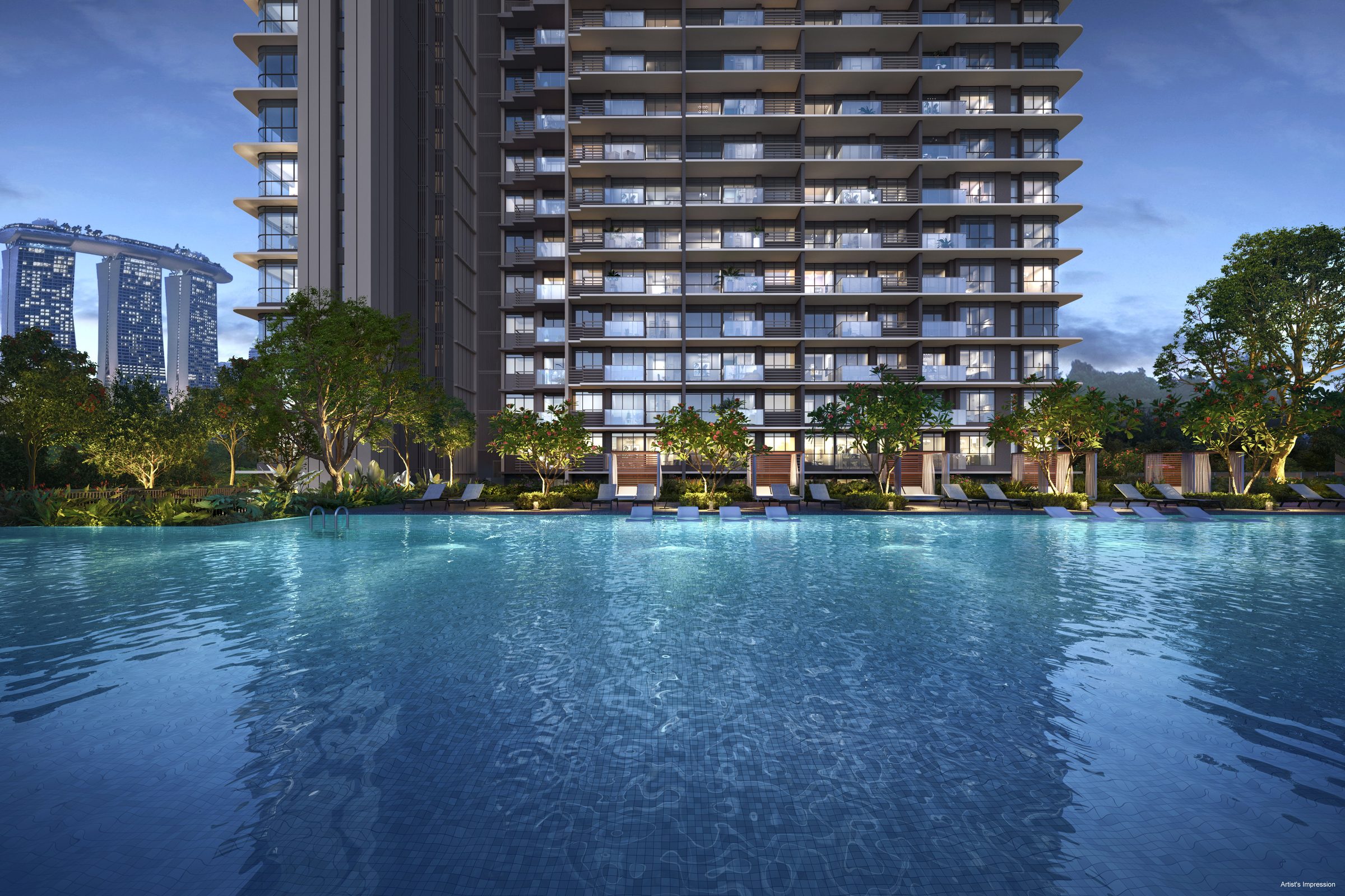 One Marina Gardens towers at dusk seen across the landscape deck pool